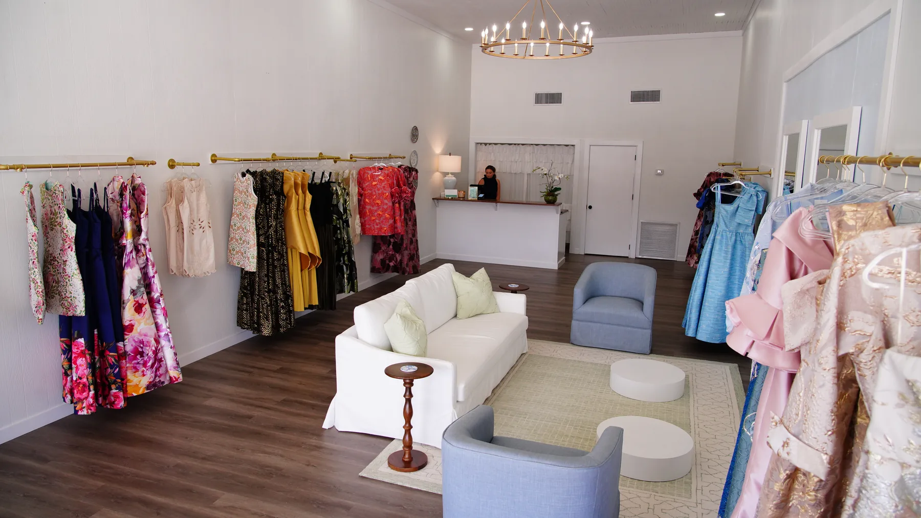 The welcoming interior of the Occasions boutique with colorful formal dresses